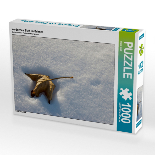 Verdorrtes Blatt im Schnee (Puzzle)